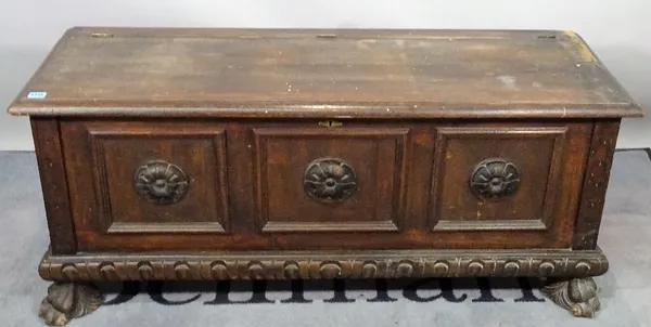 A modern oak coffer, 124cm wide x 41cm high, and a modern stained beech sliding top trunk, on bun feet, 120cm wide x 49cm high.