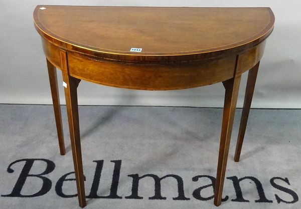 An Edwardian mahogany and line inlaid demi-lune foldover card table, 91cm wide x 73cm high.