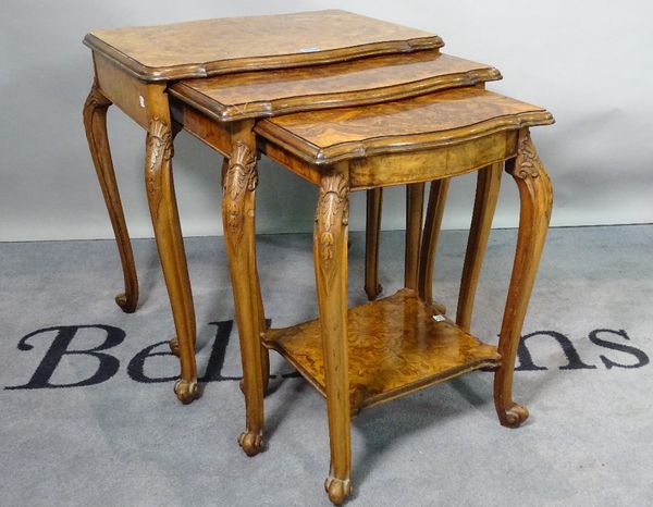 A Victorian style burr walnut nest of three tables, the largest 59cm wide, and an early 20th century walnut single drawer side cupboard, on bracket fe