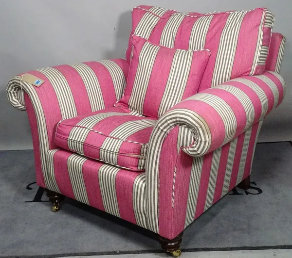 'DURESTA', a modern hardwood framed armchair, with pink striped upholstery on turned supports, 106cm wide x 82cm high.