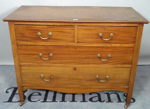 An early 20th century mahogany chest of two short and two long drawers on tapering supports, 106cm wide x 83cm high.