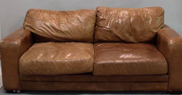 A modern brown leather sofa on block feet, 200cm wide.