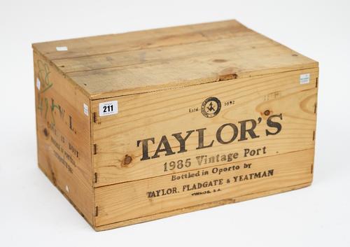 Twelve bottles of 1985 Taylor's Vintage Port, cased and sealed.