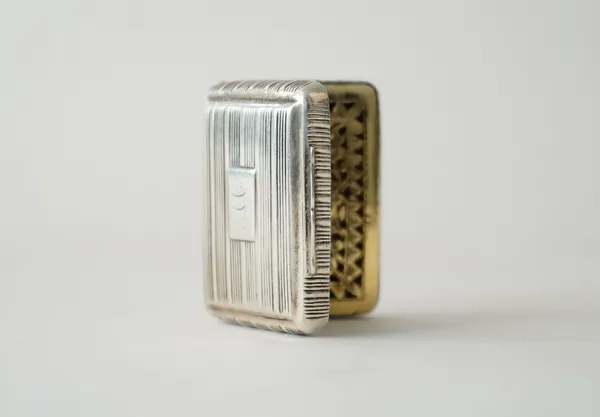 A George III silver vinaigrette, gilt within with a floral and foliate pierced and engraved grille, the exterior with banded decoration, Birmingham pr