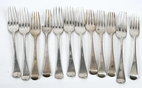 Four Old English pattern silver dessert forks London 1824 and eight further Old English pattern silver dessert forks of various dates, combined weight
