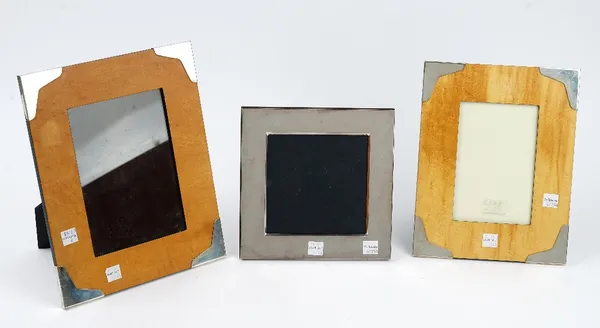 A silver mounted rectangular wooden photograph frame, size of frame 26.4cm x 21.3cm, a silver mounted rectangular wooden photograph frame, size of fra