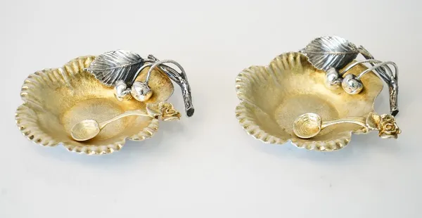 A pair of Italian silver salts, each of cast flowerhead form, lightly gilt, the handles formed as a spray of cherries with a leaf, detailed Cassetti F