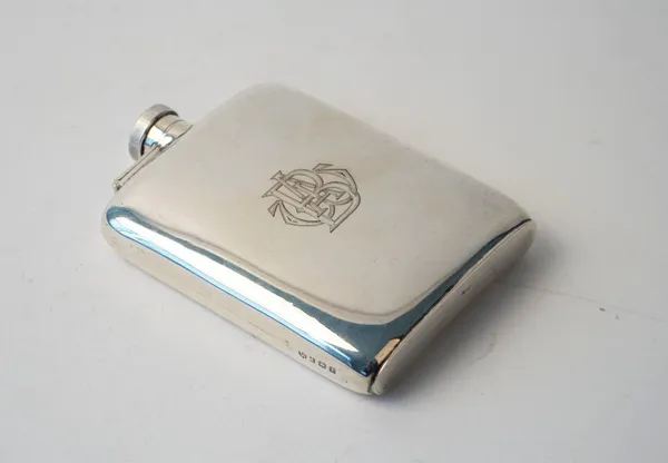 A silver spirit flask of curved rectangular form, monogram engraved, Birmingham 1916, weight 171 gms.
