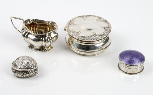 Silver, comprising; a circular hinge lidded box, the border of the cover decorated with floral sprays, a heart shaped hinge lidded box, with embossed
