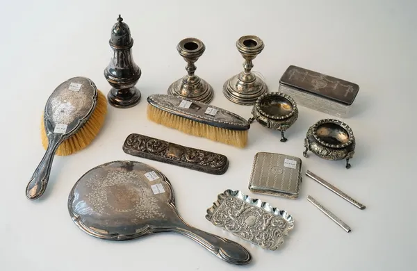 Silver and silver mounted wares, comprising; a sugar caster, Birmingham 1916, a shaped rectangular trinket dish, London 1898, a cigarette case, a pair