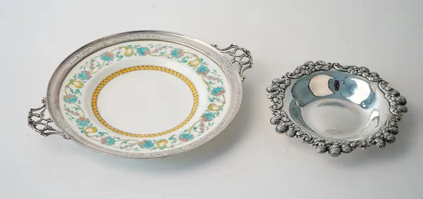An American Tiffany & Co Sterling Silver shaped circular dish, decorated with a floral and foliate rim, diameter 16cm, weight 129 gms and a Sterling m