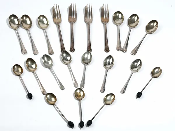 A group of silver table flatware, comprising; six teaspoons, six coffee spoons, five coffee spoons having black bean ends to the handles and four past