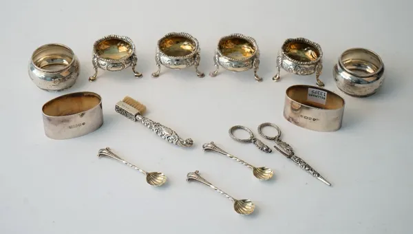 Silver, comprising; a set of four Victorian salts each of circular form raised on three feet London 1865, three salt spoons London 1866, two pairs of