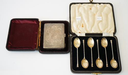 A silver rectangular cigarette case, the exterior with floral and scroll engraved decoration, Birmingham  1901, with a case and a set of six silver te
