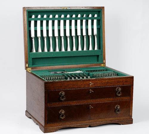 A silver rat tail pattern canteen of table flatware for twelve place settings; comprising; twelve pairs of fish knives and forks, four serving spoons,