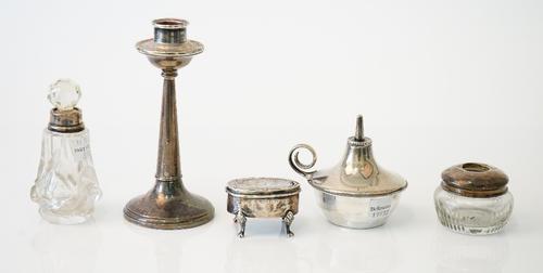 Silver and silver mounted wares, comprising; a table lighter, Birmingham 1924, weight 68 gms, one candlestick, a glass hair tidy jar, a glass scent bo