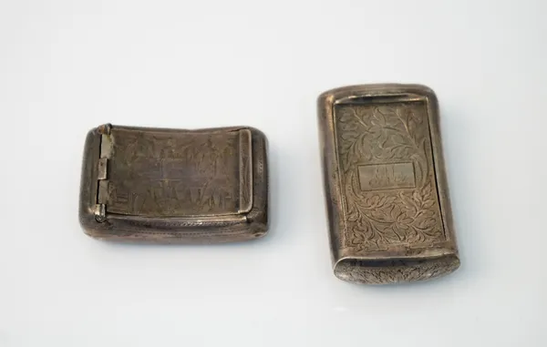 A George IV silver hinge lidded snuff box, of curved rectangular form, with engraved decoration, Birmingham possibly 1828 and another silver hinge lid