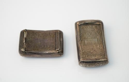 A George IV silver hinge lidded snuff box, of curved rectangular form, with engraved decoration, Birmingham possibly 1828 and another silver hinge lid