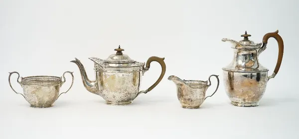 A silver four piece tea and coffee set, comprising; a teapot, a hot water or coffee jug, a twin handled sugar bowl and a milk jug, each piece decorate