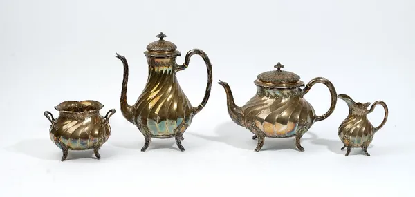 A French four piece tea and coffee set, comprising; a teapot, a coffee pot, a twin handled sugar bowl and a milk jug, each piece of baluster form with