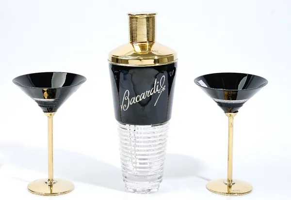 A silver gilt mounted black and faceted glass cocktail shaker, detailed Bacardi and a pair of silver gilt mounted dark brown and faceted glass cocktai