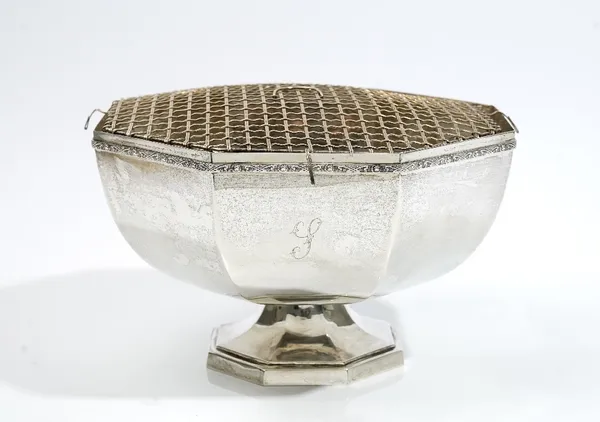 A silver rose bowl, of octagonal form, decorated with a cast rim, raised on an octagonal foot, London 1970, 25.5cm across, weight 1040 gms, with a pla