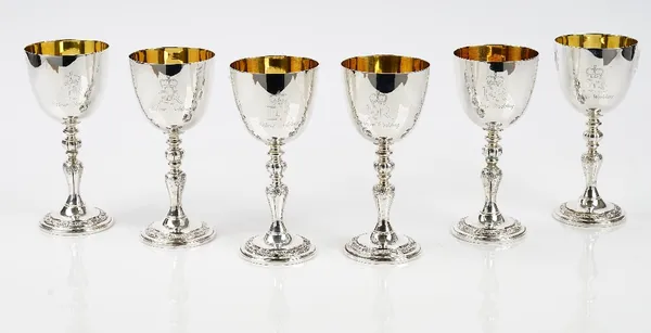 A set of six silver wine goblets, the stems and the circular bases decorated with fruiting vine, London 1972, by Garrard London, height 15cm, combined