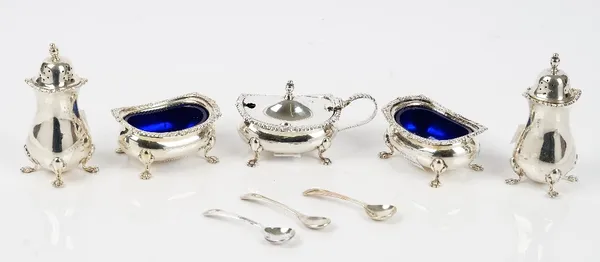 A silver five piece condiment set, comprising; a mustard pot, a pair of salts and a pair of pepperettes, Birmingham 1966 and three Old English pattern