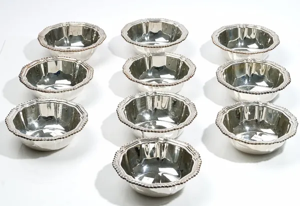 Six silver bowls, of shaped circular form, decorated with gadrooned rims, diameter 13cm, Sheffield 1966 and four further silver bowls, of similar desi