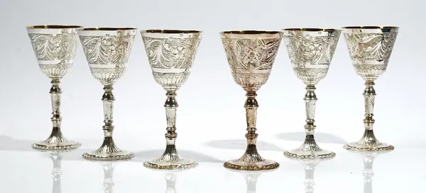 A set of six Britannia Standard silver goblets, with floral and foliate decoration, gilt within the bowls, London 1977, height of goblet 16cm, combine