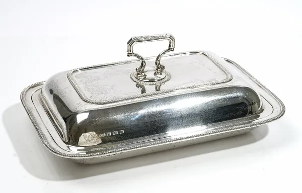 A silver rectangular lidded entree dish, of rectangular form, decorated with beaded rims, Sheffield 1930, having a detachable handle, weight 1232 gms.