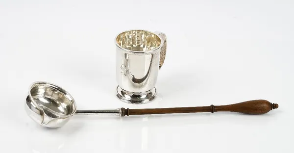 A silver Christening mug with a C shaped handle, Birmingham 1981, weight 138 gms, a pair of European butter dish stands, each with cast and pierced de