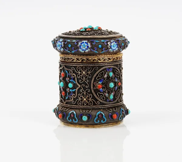 An Asian silver gilt, enamel, turquoise and coral set cylindrical container and cover, the exterior with enamelled and gemset highlighting to the fili