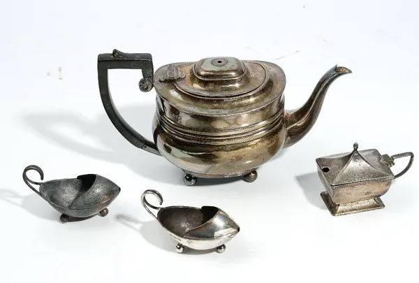 A bachelor's Regency style silver teapot, William & George Sissons, London 1902, rounded oblong, with blackwood scroll handle and finial to the hinged