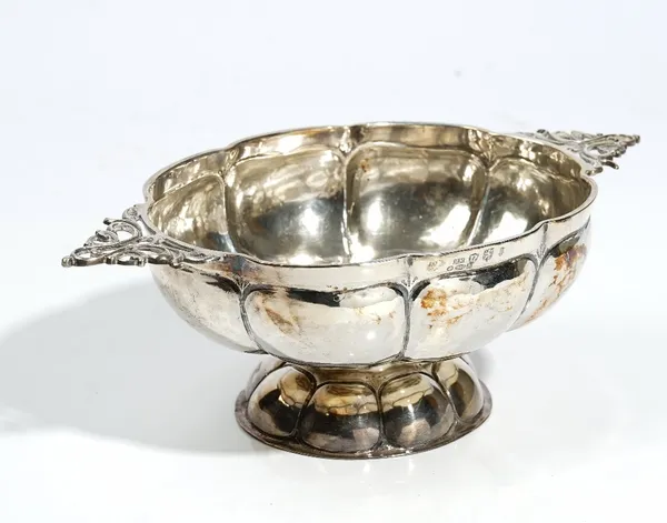 A Dutch silver brandy bowl, English Import marks for Chester 1908, oval with lobed sides and foot and pierced handles, 24.5cm wide, 8.5ozs.