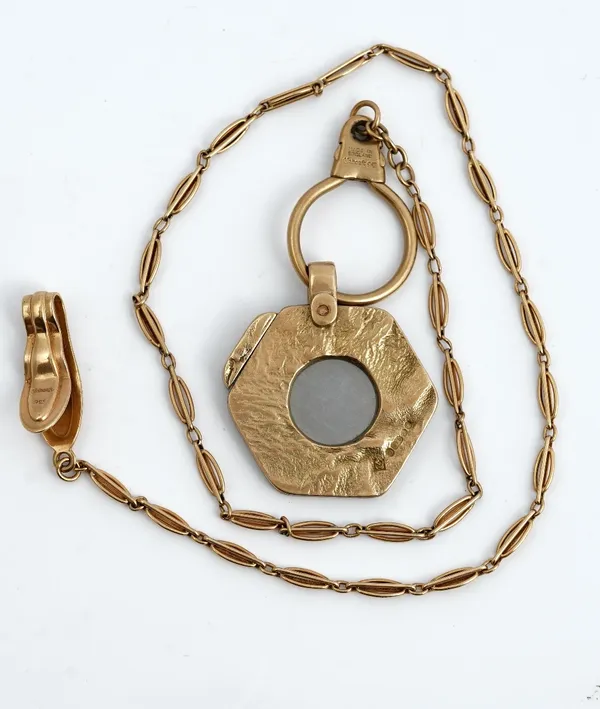 A 9ct gold mounted Dunhill slide action cigar cutter, of hexagonal form, having a textured finish, London 1967, with a gold mounted key chain, fitted