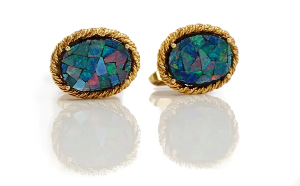 A pair of 9ct gold and opal dress cufflinks, each oval front having a opal mosaic within a cast ropetwist surround, the backs with folding bar fitting