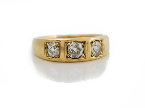 An 18ct gold and diamond set ring, of tapered design, set with three graduated old mine cut diamonds, ring size P, 6gms.