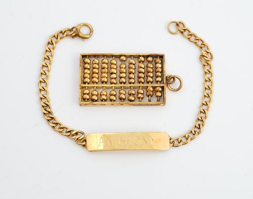 A gold pendant, designed as an abacus, detailed 14 K and a gold faceted curb link identity bracelet, detailed Anthony, combined weight 14.2 gms, (2).