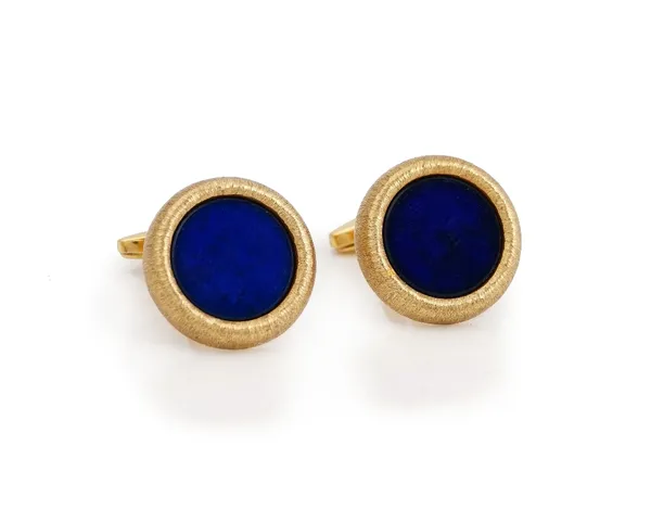 A pair of 9ct gold mounted stained blue stone dress cufflinks, having circular fronts within textured borders and with folding bar fittings at the bac