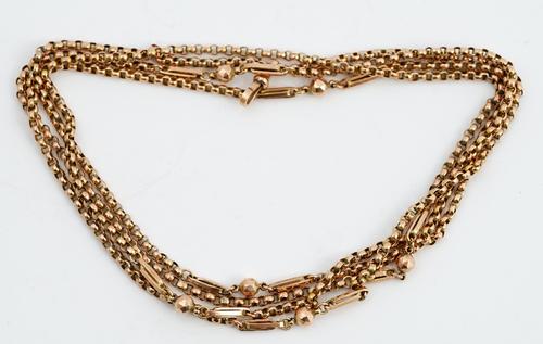 A 9ct gold fancy belcher link long chain, interspersed with bead and baton links, 32.7gms, fitted with a gold swivel.