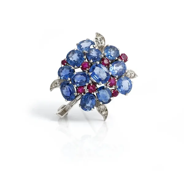 A sapphire, ruby and diamond brooch, in a floral design, mounted with oval cut sapphires, smaller circular cut rubies, baguette and circular cut diamo