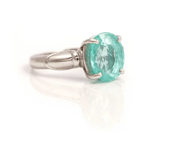 An 18ct white gold ring, claw set with an oval cut, paraiba tourmaline, gross weight 4.7 gms, with a certificate card stating the gem weight 2.281ct a