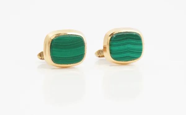 A pair of 9ct gold and malachite cufflinks, each with a curved rectangular front and with folding bar fittings at the back, London 1978, gross weight