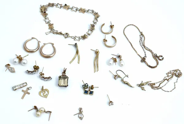 A group of mostly 9ct gold jewellery, comprising; eleven pairs of earrings, four pendants, a bracelet and two chains, combined gross weight 16.7 gms,