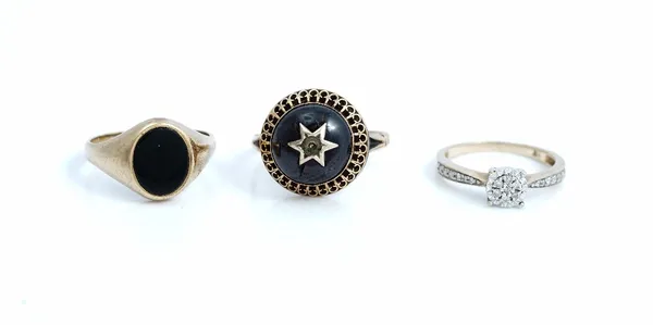 A 9ct gold and diamond cluster ring, with diamond set shoulders, ring size K and a half, a 9ct gold and oval black onyx signet ring, ring size N and a