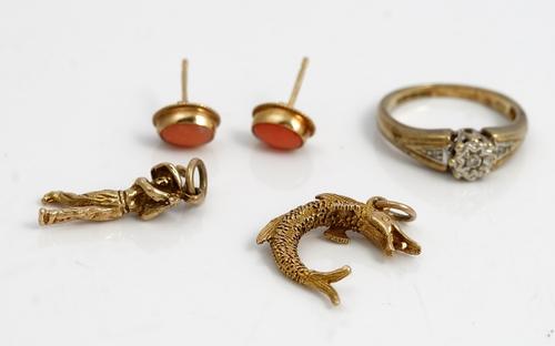 A 9ct gold and diamond ring, mounted with a circular cut diamond, between diamond set single stone shoulders, detailed 0.10, ring size L 1/2, two 9ct