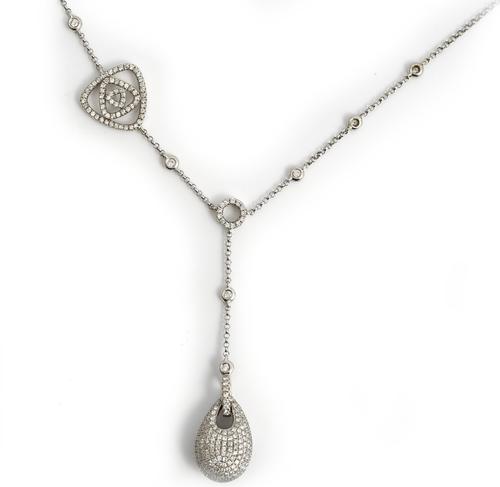 An 18ct white gold and diamond pendant necklace, the front with a pear shaped drop, pave set with circular cut diamonds, a circular motif above and wi