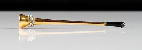 An Asprey 9ct gold, platinum and diamond mounted lady's cigarette holder, the mount of stylised coronet form, set with circular cut and rose diamonds,