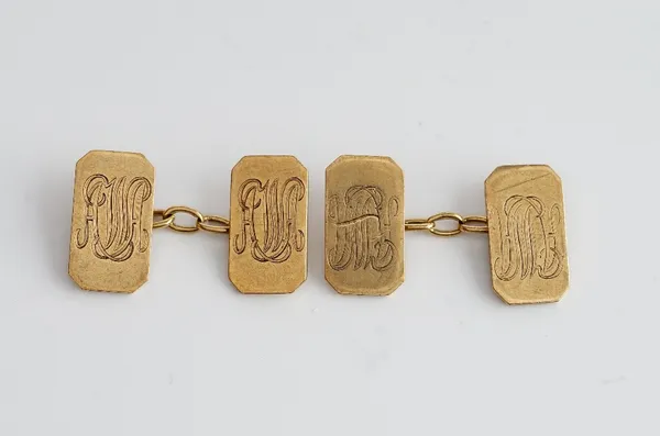 A pair of 9ct gold cut cornered rectangular cufflinks, the backs and the fronts monogram engraved, Birmingham 1946, weight 9 gms, with a case.